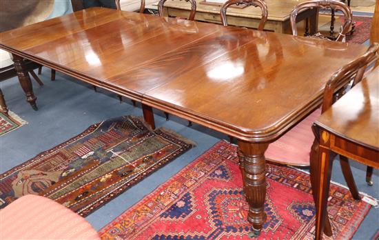 A mid Victorian mahogany extending dining table, with four spare leaves 275cm extended